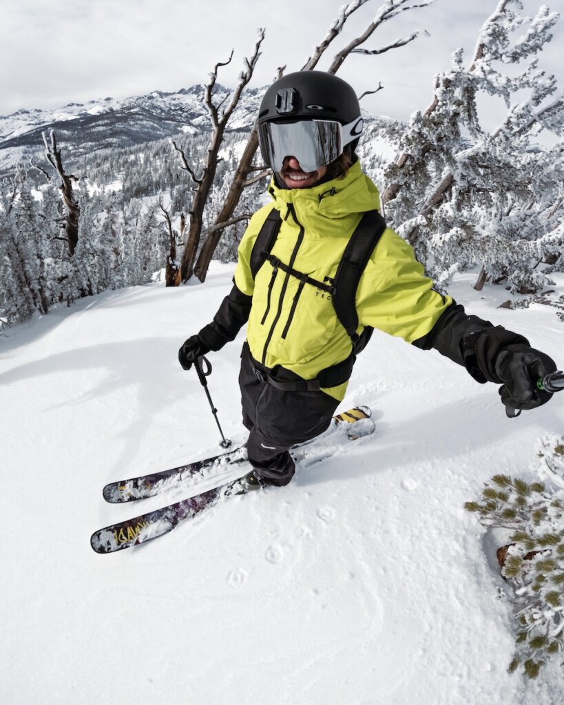 Abe Kislevitz skiing through mountains for work