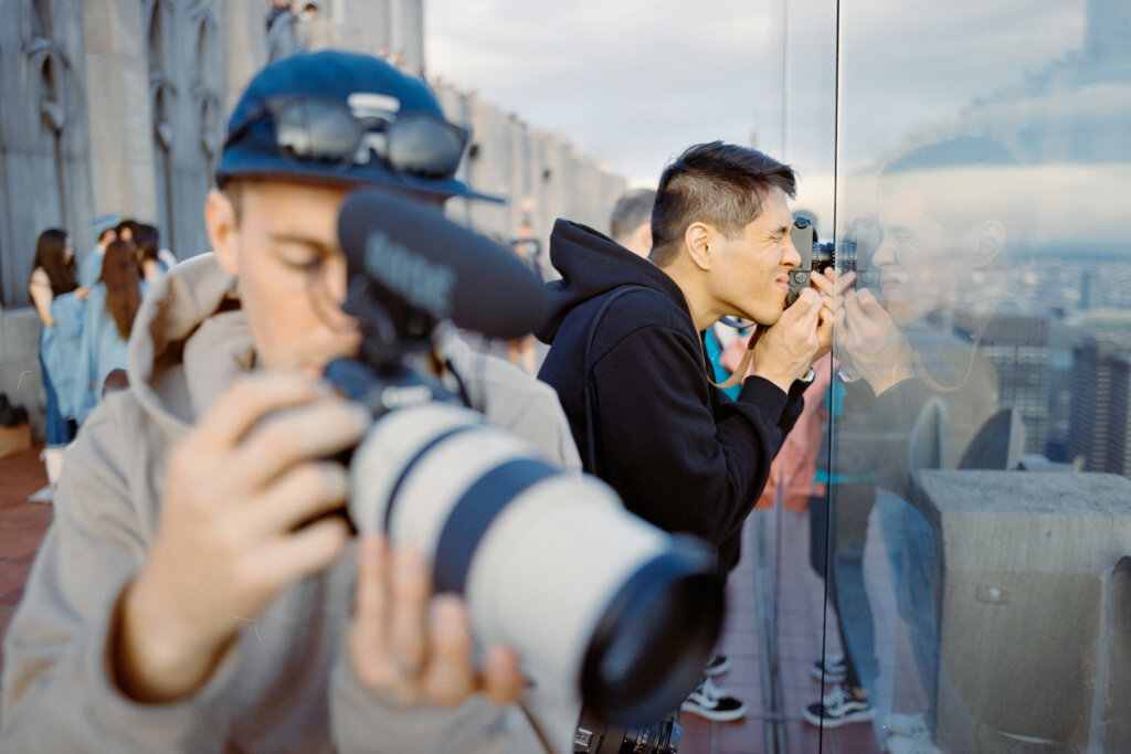 Gene Yoon taking photo of city on skyrise