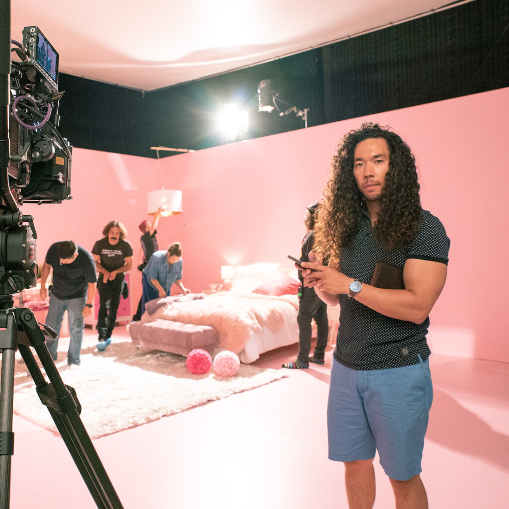 Cole Walliser on set that is all pink