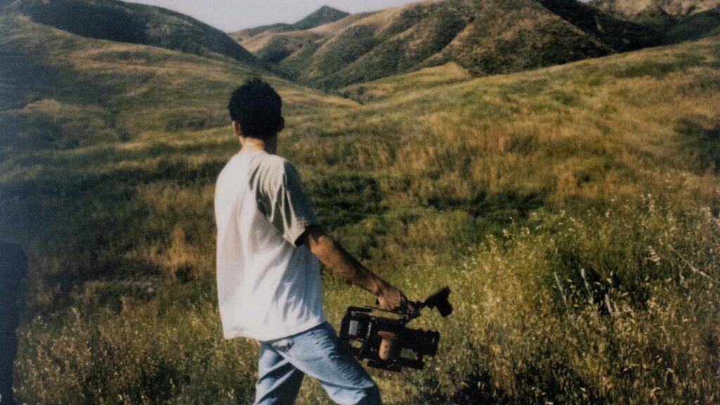 Serr Villasano with camera in field