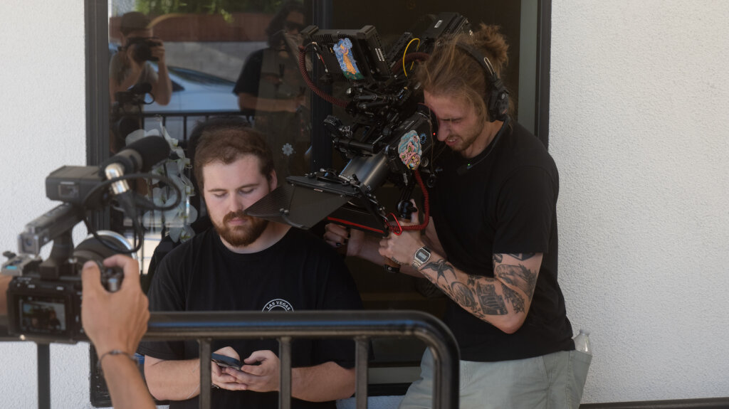 Brady Bessette filming phone in hands